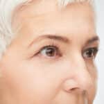 Close up of senior woman eyes. Gray short hear.
