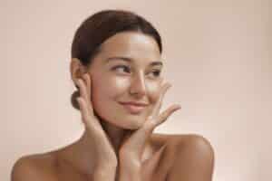 Woman smiling after wrinkle relaxer treatment.